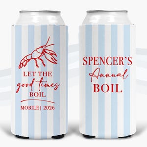 May include: Two white and light blue striped can coolers. One cooler features a red crawfish illustration and the text "LET THE good times BOIL MOBILE | 2026". The other cooler reads "SPENCER'S Annual BOIL".