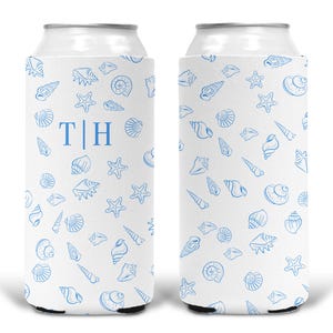 May include: Two white foam can coolers featuring a repeating pattern of light blue seashells and starfish. The left cooler displays the letters T and H separated by a vertical line in a blue serif font, while the right cooler shows the pattern.
