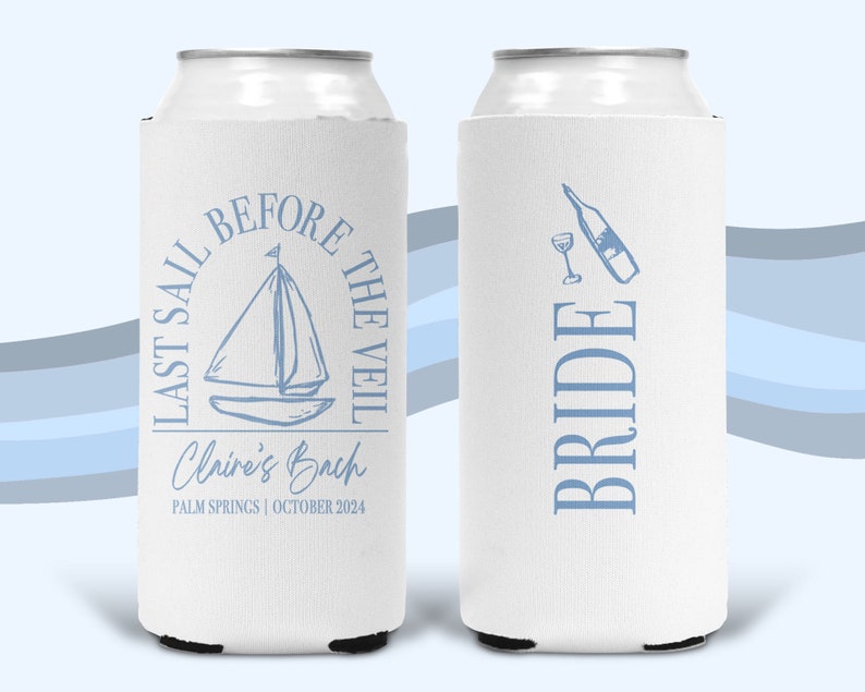 May include: Two white foam can coolers featuring light blue graphics. One side displays a sailboat with the text "LAST SAIL BEFORE THE VEIL," "Claire's Bach," and "PALM SPRINGS | OCTOBER 2024." The other side shows a wine bottle, glass, and "BRIDE."