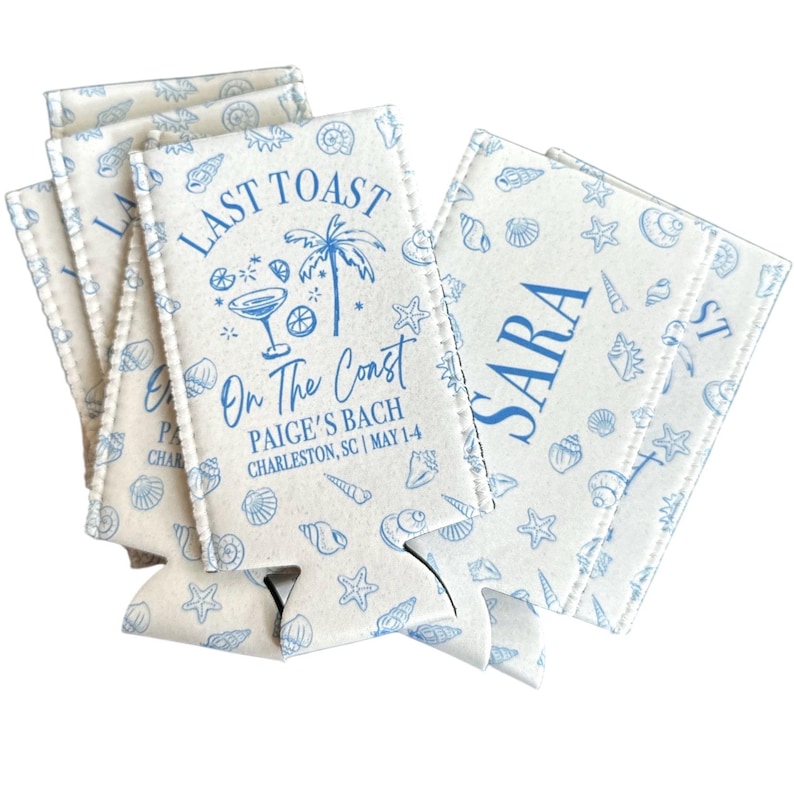 May include: A set of white foam can coolers featuring a blue pattern of seashells and starfish. The text reads LAST TOAST On The Coast PAIGE'S BACH CHARLESTON, SC | MAY 1-4, while another cooler displays the name SARA in large blue capital letters.