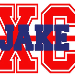May include: A graphic design featuring the name "JAKE" in blue block letters, overlaid on a red and white "XC" design with an arrow. The design is bold and eye-catching, perfect for sports team apparel.