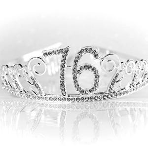 May include: Silver tiara with rhinestones, featuring the number "16" in the center.