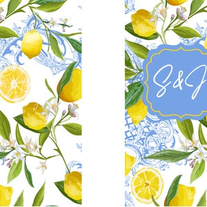 Puede incluir: Un patr&oacute;n floral azul y blanco con limones y flores blancas. Un rect&aacute;ngulo azul con borde amarillo y el texto "S&J" en blanco.