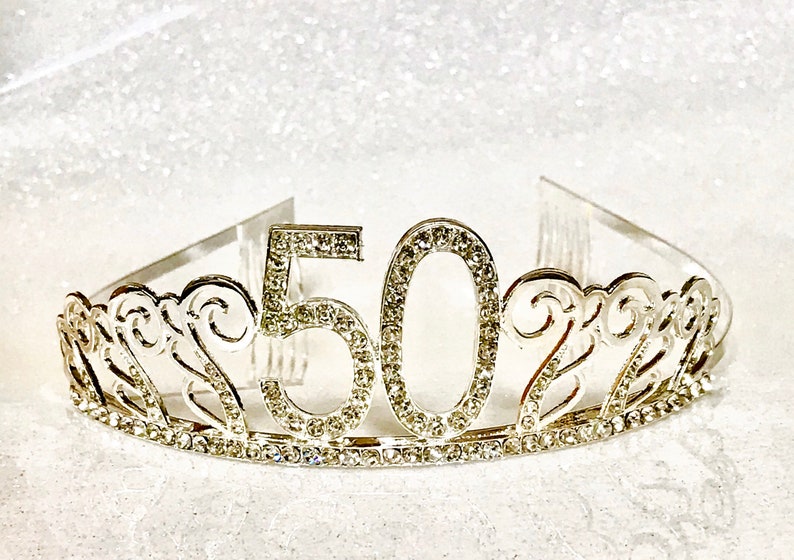 May include: Silver tiara with rhinestones, featuring the number 50.