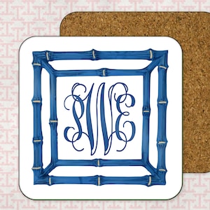 May include: White coaster with a blue bamboo frame and a monogram of the letters "NVE" in black.