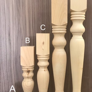 May include: Five wooden table legs in different sizes, labeled A through E. The legs are all the same style, with a turned, bulbous shape. The legs are shown against a woodgrain background. The legs are 6 inches, 18 inches, 21 inches, 29 inches, and 35 inches tall.