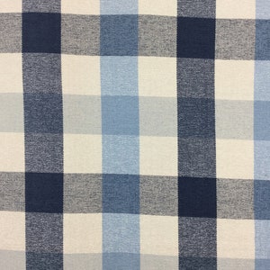 May include: A close-up of a fabric with a checkered pattern in shades of blue and white.
