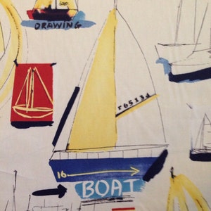 May include: A white background with a yellow, blue, and black sailboat illustration. The sailboat has a yellow sail and a blue hull. The words "BOAT" and "16" are written on the hull. The words "r 65134" are written on the sail. The words "DRAWING" and "PATTERN" are written on the background.