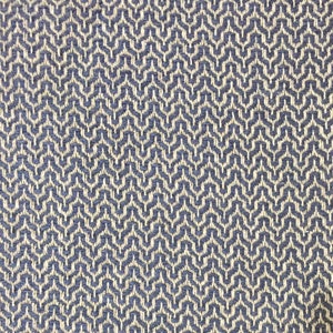 May include: A close-up of a woven fabric with a geometric pattern. The fabric is a light blue color with a white pattern.