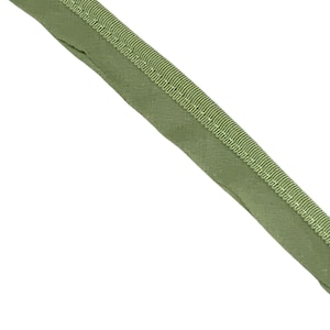 May include: Close-up of a length of olive green bias tape. The tape has a folded edge and a stitched border, creating a clean, finished look. The fabric appears to be a solid color, suitable for various sewing projects.