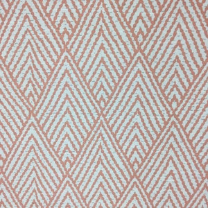 May include: A white fabric with a pink geometric pattern of repeating diamond shapes. The diamonds are made up of small, connected circles.