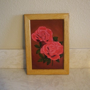 Original oil painting of  roses on a wood panel and Oak frame