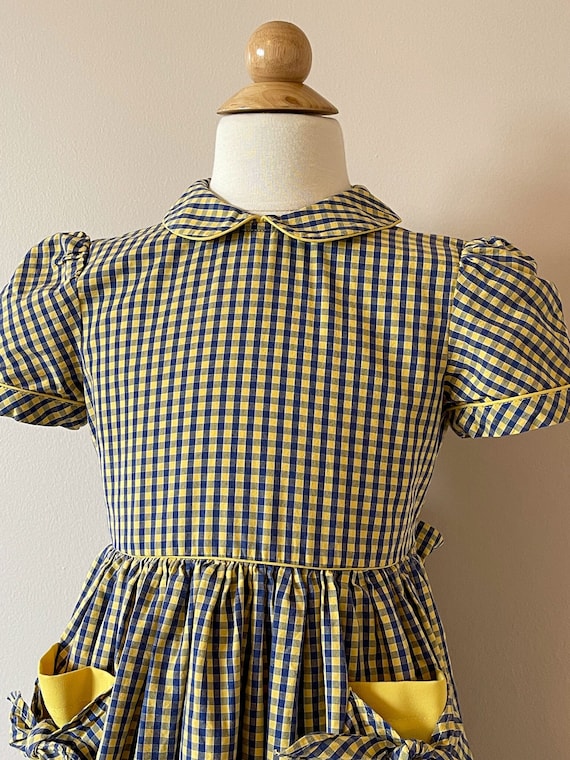 Girls size 6:  Check plaid dress with bow pockets,