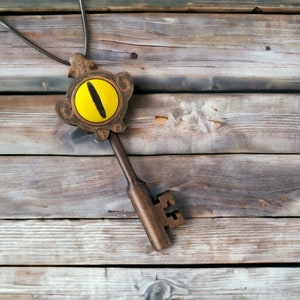 Accesorio colgante con forma de llave del portal inspirado en la Casa del Búho