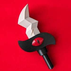 May include: A white lightning bolt shaped sword with a black handle and a red eye on the hilt.