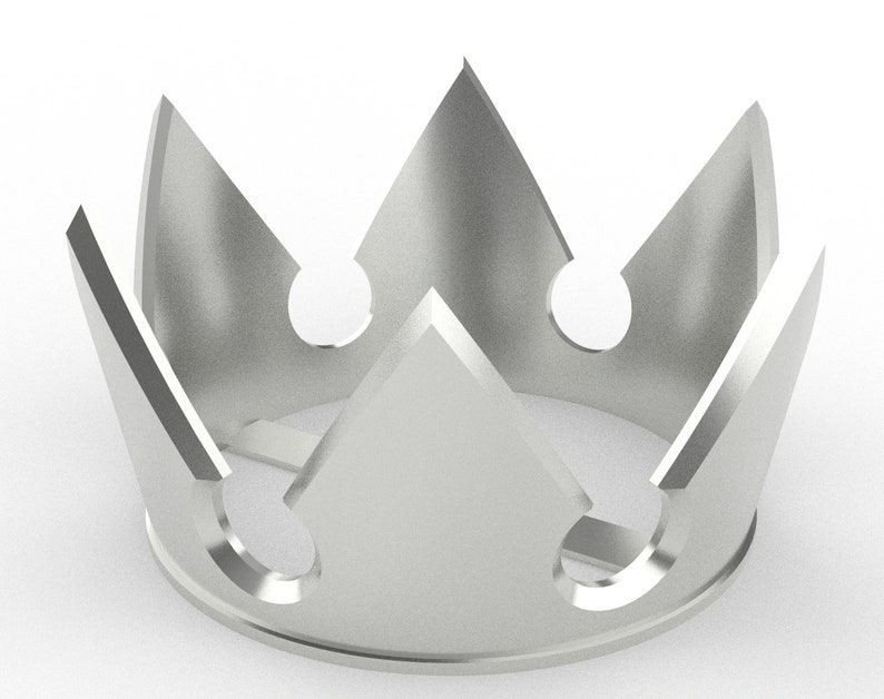 Pode incluir: Uma coroa prateada com um design pontiagudo e tr&ecirc;s recortes circulares. A coroa &eacute; feita de metal e tem um acabamento brilhante.
