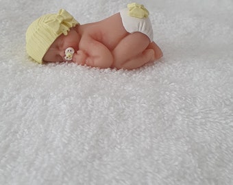 Handmade Ooak polymer fimo clay sleeping baby cake topper, baby shower, dolls house bow hat yellow with a dummy/pacifer