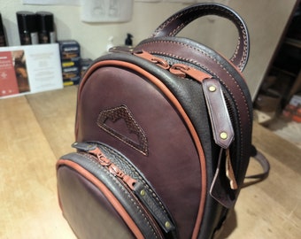 Small handcrafted backpack in brown leather