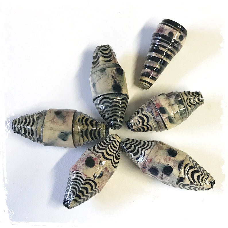 Carved paper bead set with cone bead, dotted black gray oval bea