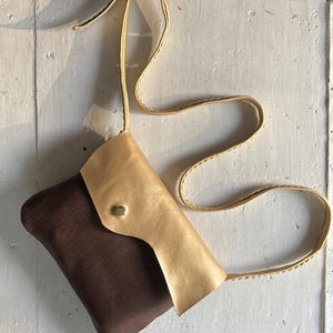 GOLD TAN is a handmade shoulder bag in gold and brown recycled leather