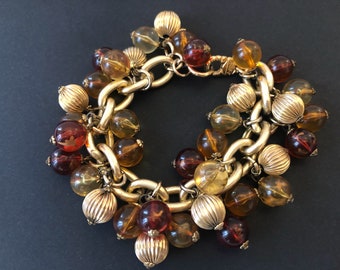 JACKY DE G. Massive Clear Orange Color Charms Bracelet