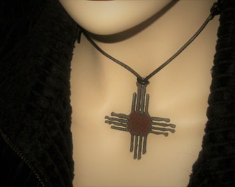 Rustic Iron Zia Sun Necklace: Adjustable Black Leather Cord