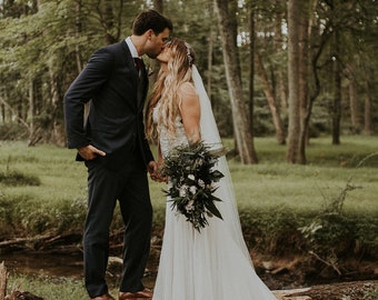 Woodland boho wedding cascading bridal bouquet, white real flowers and greenery eucalyptus ferns, woodsy realistic natural floral decoration