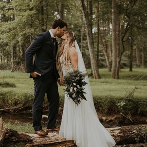 Woodland boho wedding cascading bridal bouquet, white real flowers and greenery eucalyptus ferns, woodsy realistic natural floral decoration
