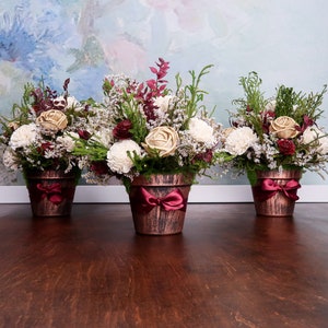 Burgundy wine green gold rustic wedding centerpiece Sola Flowers floral arrangement preserved cypress cedar rose elegant table decor
