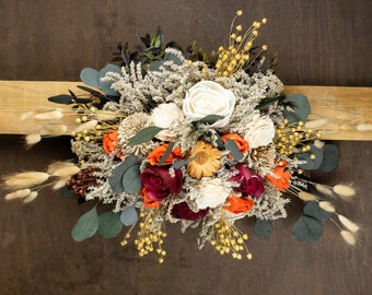 Sola flowers fall wedding arch floral swag arrangement, orange green burgundy dried flowers grasses grains, preserved eucalyptus greenery