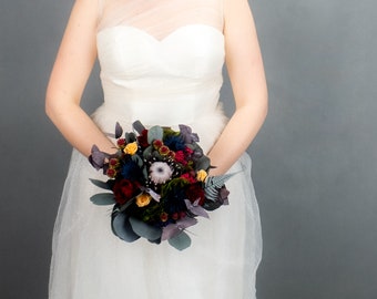 Dark realistic wedding bouquet, red peach burgundy navy preserved flowers protea eucalyptus thistle, woodsy natural floral decoration