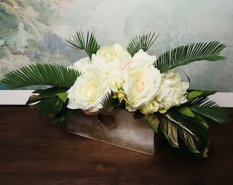 Tropical wedding centerpiece with ivory flowers and greenery, realistic silk peonies roses gold monstera leaves modern wedding wooden pot