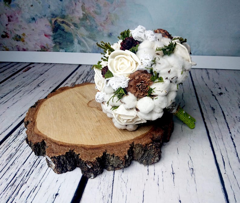 Natural wedding bouquet with cotton bolls greenery rustic woodland winter wedding sola flowers and cedar rose
