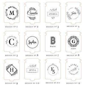 May include: A collection of twelve personalized wooden signs with various designs. Each sign features a unique combination of text, initials, and floral or decorative elements. The designs include names like "Camila" and "Angela", and initials like "M" and "G".