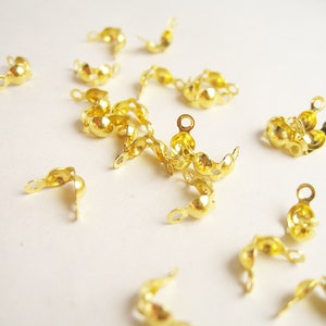 Lot of 4g (+- 45pcs) gold metal knot cover end clips 7x4mm