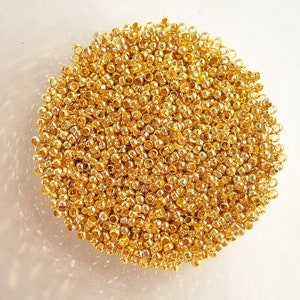 Lot de 3g perles rondes à écraser métal doré 2mm (+-250pcs)