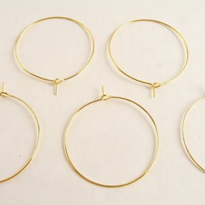 Set of 4 pairs of 18k gold plated rings supporting golden hoop earrings 20 or 40mm
