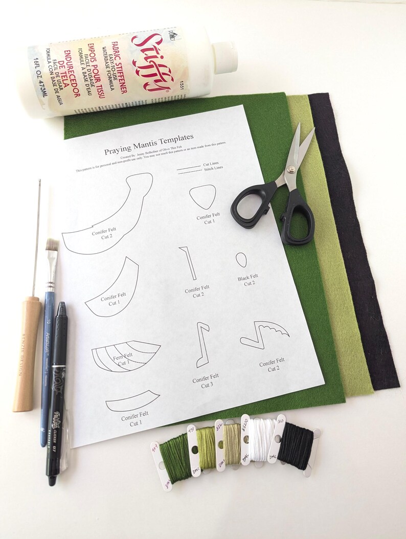 May include: Craft supplies for a DIY project, including a bottle of fabric stiffener, scissors, felt sheets in green and black, embroidery floss, and a printed template labeled "Praying Mantis Templates."