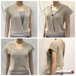 May include: A crocheted cream-colored top with a V-neck and short sleeves. The top has a criss-cross front and a open back.