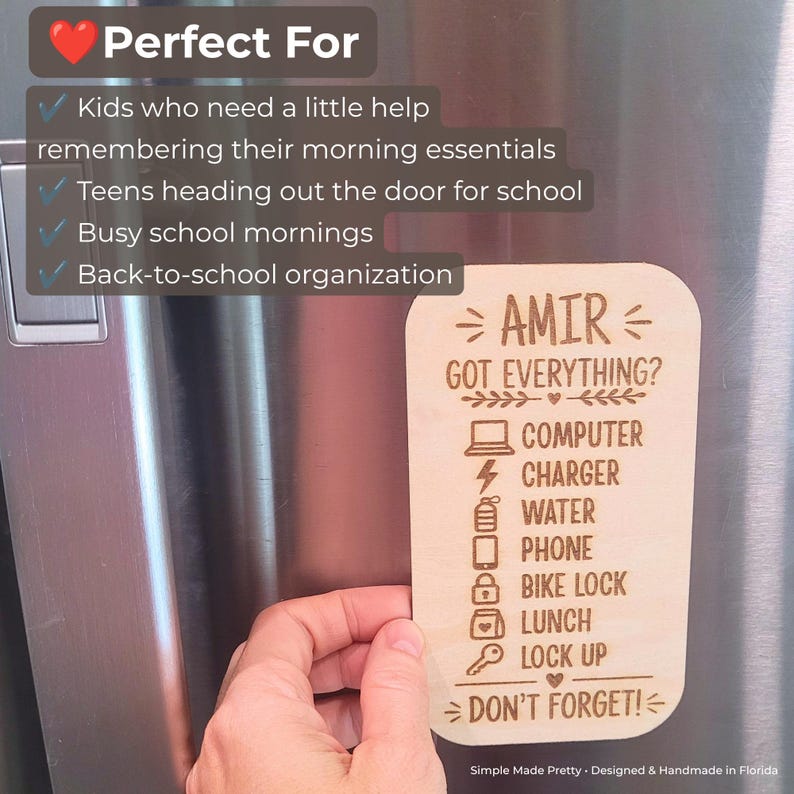 May include: A rectangular light-colored wooden magnet with rounded corners featuring laser-engraved text and icons. The text reads: AMIR GOT EVERYTHING? COMPUTER, CHARGER, WATER, PHONE, BIKE LOCK, LUNCH, LOCK UP, DON'T FORGET! with corresponding icons.