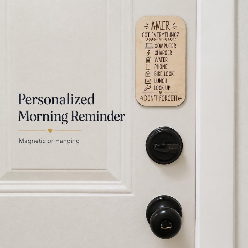 May include: A rectangular light wood sign with rounded corners featuring the engraved text AMIR GOT EVERYTHING? followed by a checklist of icons and words including COMPUTER, CHARGER, WATER, PHONE, BIKE LOCK, LUNCH, LOCK UP, and DON'T FORGET!