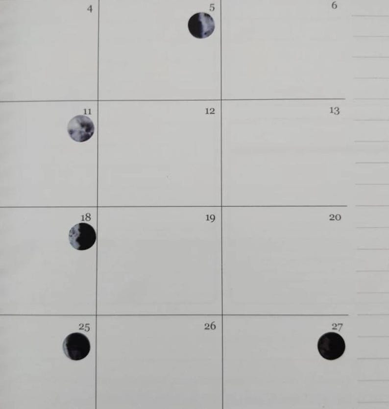 May include: A calendar page featuring a grid with numbered boxes. Several boxes contain circular illustrations of the moon in various phases, ranging from crescent to full. The background is a light, neutral color.