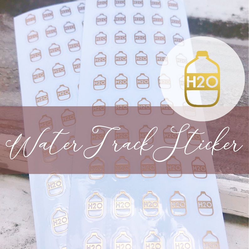 May include: A sheet of gold water bottle stickers with the text "H2O" on each sticker. The stickers are on a white background and are arranged in rows. The text "Water Track Sticker" is written in cursive on a pink background.
