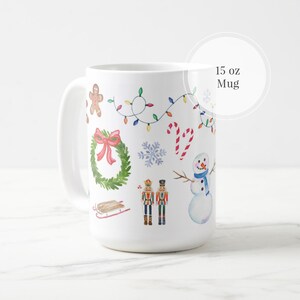 May include: White ceramic mug with a Christmas theme. The mug features a snowman, a gingerbread man, a wreath, candy canes, a nutcracker, and a sled. The mug is 15 ounces.