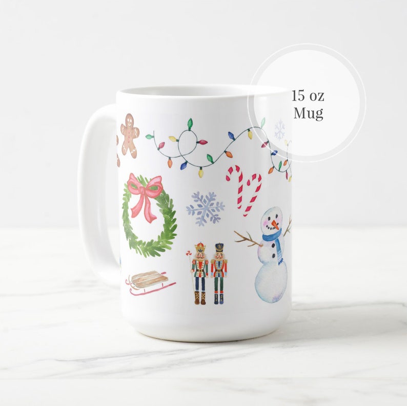 May include: White ceramic mug with a Christmas theme. The mug features a snowman, a gingerbread man, a wreath, candy canes, a nutcracker, and a sled. The mug is 15 ounces.