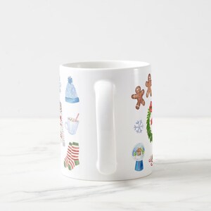 May include: White ceramic mug with a winter holiday theme. The mug features illustrations of a snowman, a gingerbread man, a snowflake, a wreath, a winter hat, a cup of hot chocolate, a pair of socks, and a snow globe.