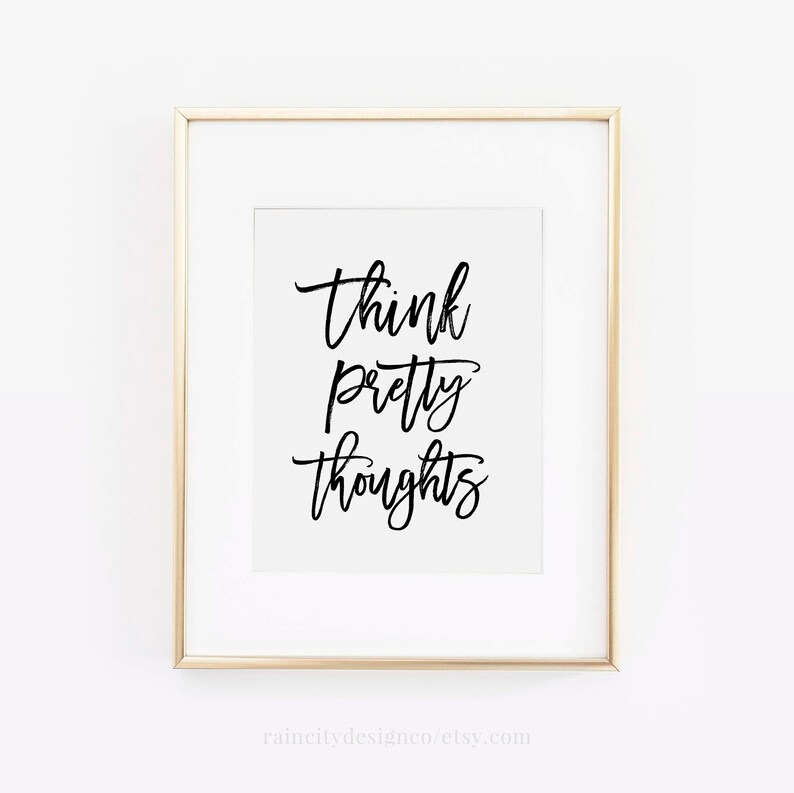 May include: A white framed print with black calligraphy that reads "Think pretty thoughts".