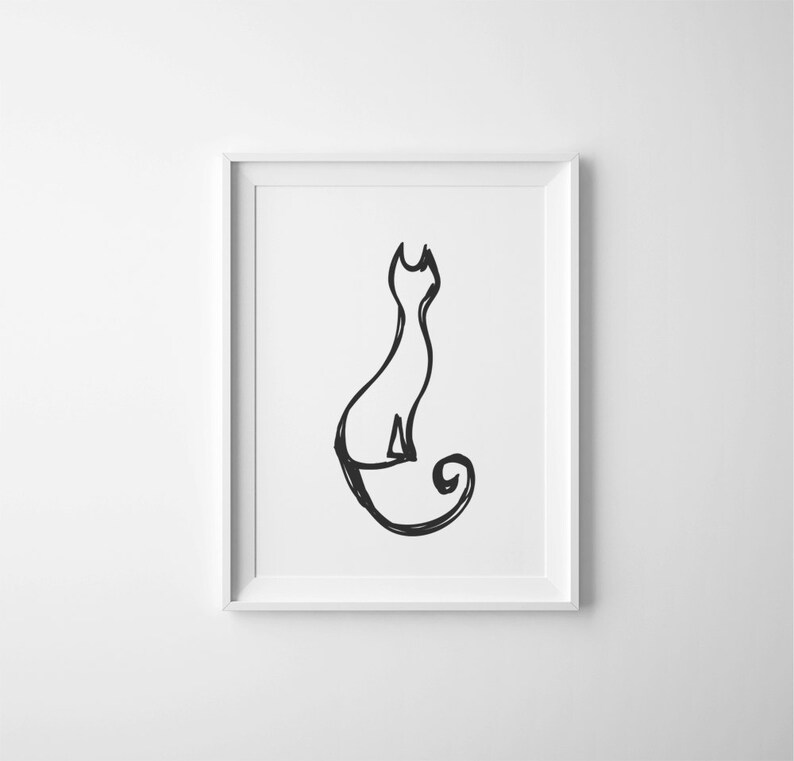 May include: A framed black and white art print featuring a minimalist line drawing of a cat in a seated position. The cat's tail curls, and the artwork is set against a white background within a white frame. The art piece is suitable for home decor.