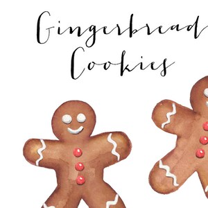May include: Two gingerbread cookies with white icing and red candy dots. The cookies are on a white background with the text "Gingerbread Cookies" written in black cursive.