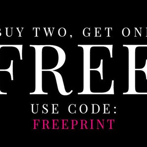 May include: Black and white graphic with the text "BUY TWO, GET ONE FREE" in white. Below the text is the word "FREE" in large white letters. Below that is the text "USE CODE: FREEPRINT" in white, with the code "FREEPRINT" in pink.